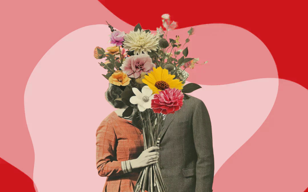 man and woman kissing behind a bouquet of flowers with a pink and red background 