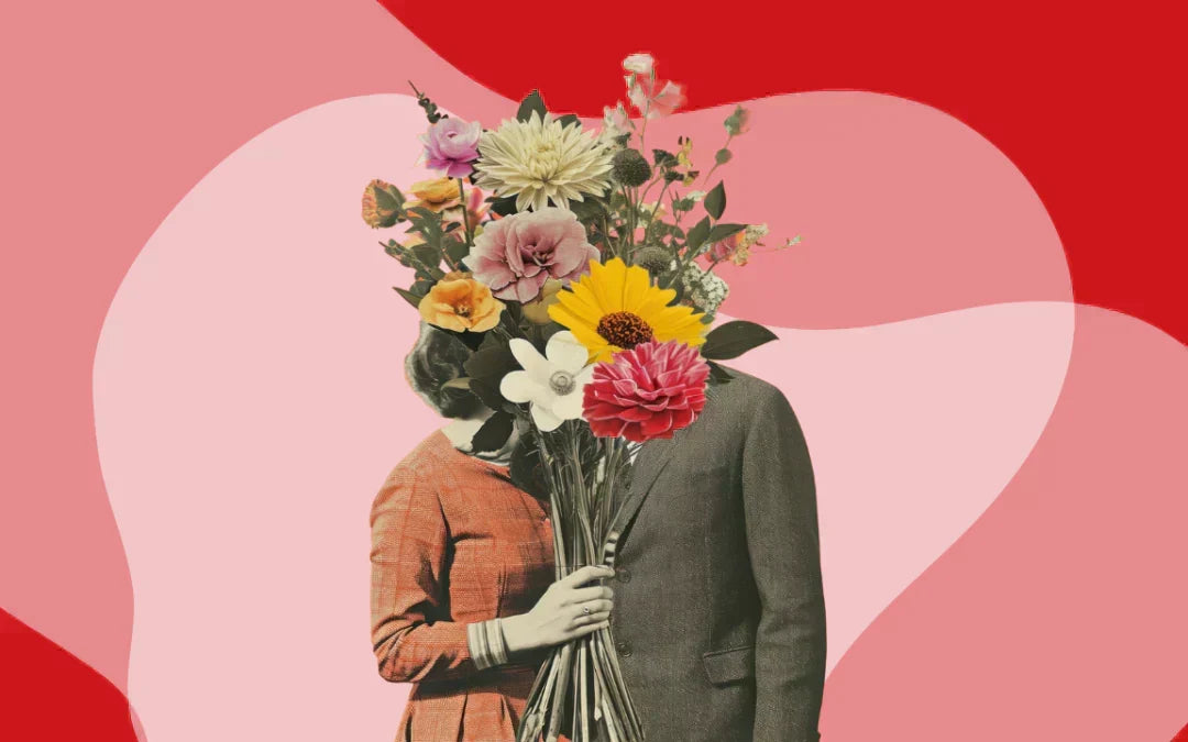 man and woman kissing behind a bouquet of flowers with a pink and red background 