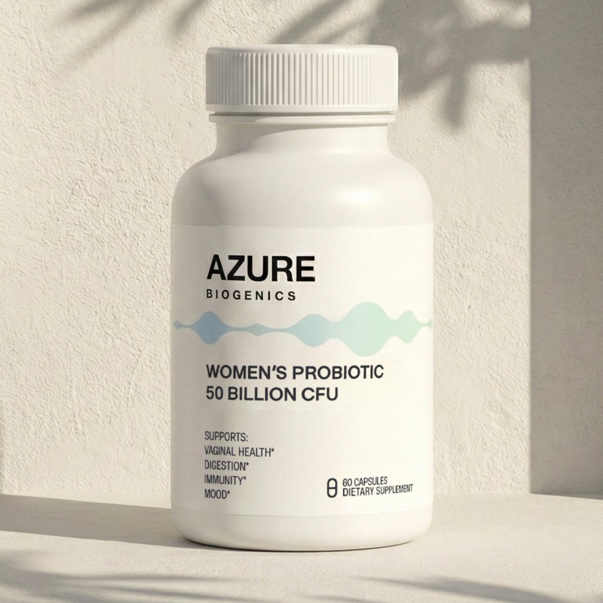 White supplement bottle labeled 'Azure Biogenics Women's Probiotic' on a light background